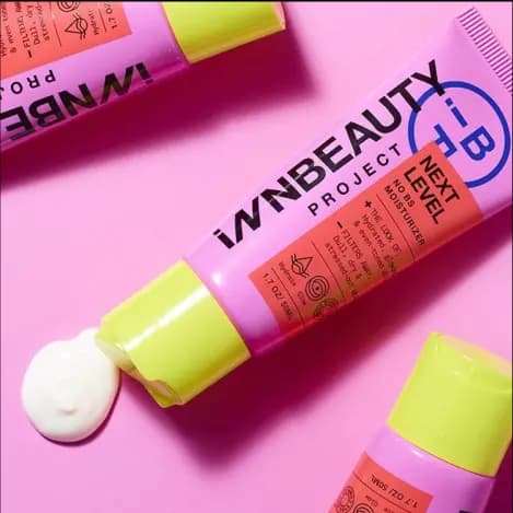 Picture of a brightly-colored pink and orange squeeze tube with yellow cap of Innbeauty product.